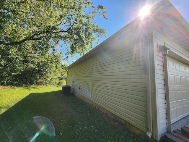 view of property exterior featuring a lawn and a garage