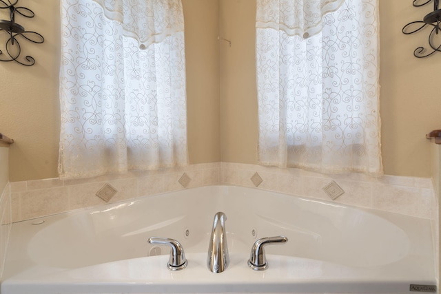 bathroom featuring a whirlpool tub