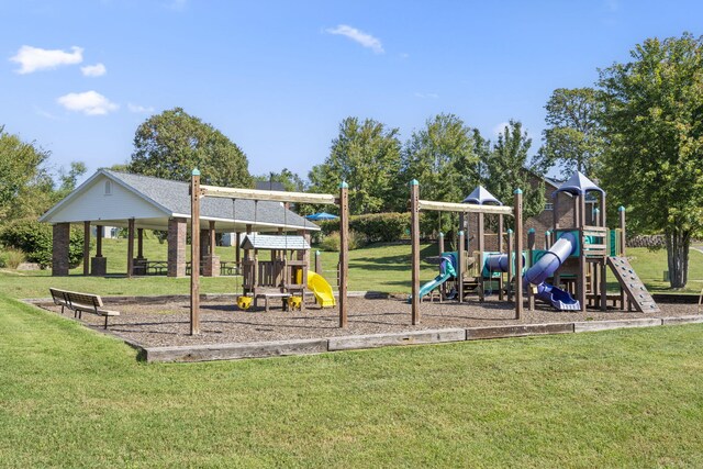 communal playground featuring a lawn