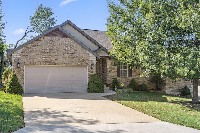 view of front facade with a garage and a front lawn