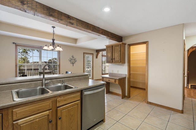 kitchen with light tile patterned floors, dishwasher, brown cabinets, decorative light fixtures, and a sink