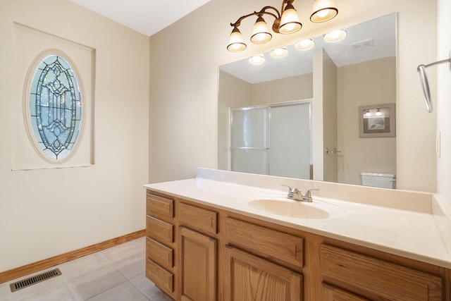 full bathroom featuring toilet, a shower stall, visible vents, and vanity