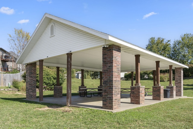 view of home's community featuring a yard, fence, a patio, and a gazebo