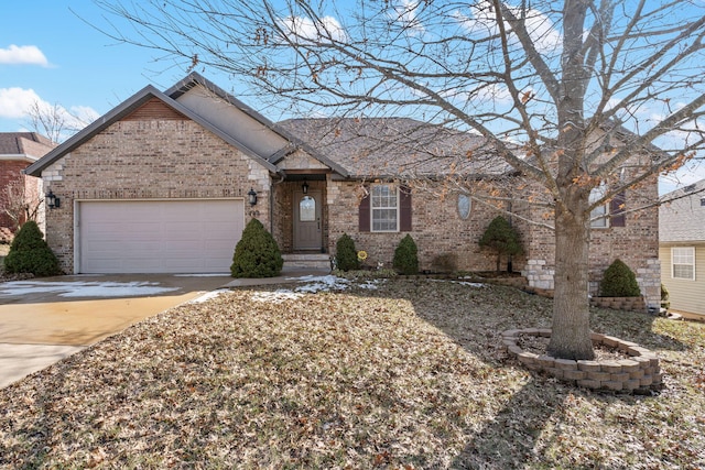 ranch-style house featuring concrete driveway, brick siding, and an attached garage