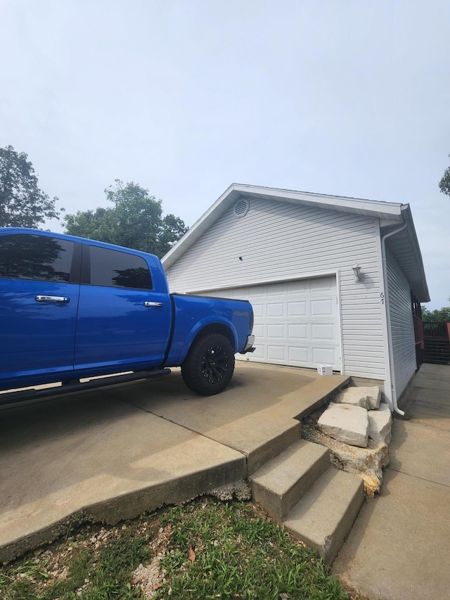 view of side of home with a garage