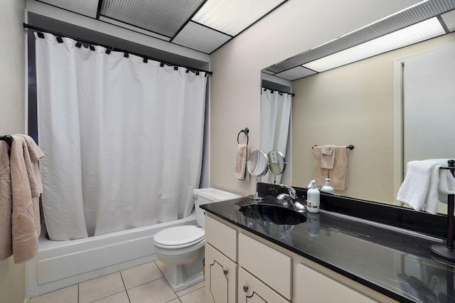 full bathroom featuring tile patterned floors, shower / bath combo, vanity, and toilet