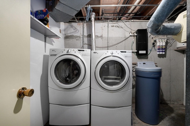 laundry area with washing machine and clothes dryer