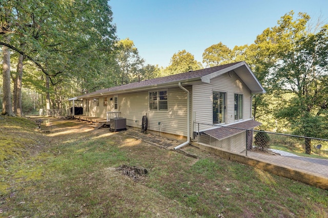 view of home's exterior with a yard and cooling unit