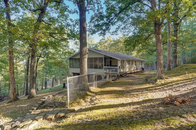 exterior space featuring a sunroom