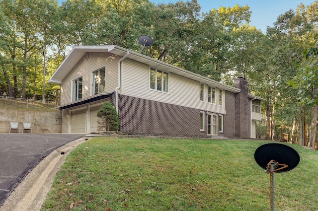 5920 State Highway A, Strafford, MO 65757 - view of side of home featuring an attached garage, asphalt driveway, and a chimney