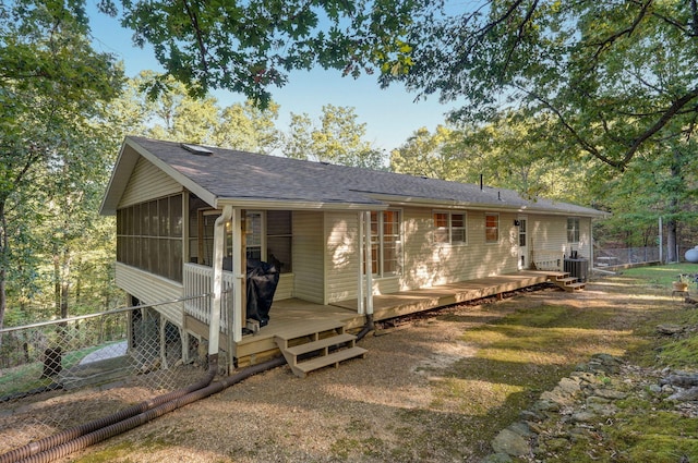 view of front of home featuring a deck and a sunroom