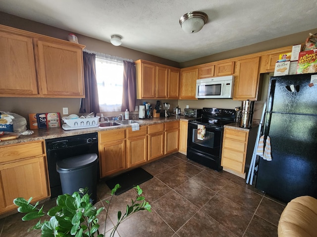 409 W Summit St, Aurora, MO 65605 - kitchen with dark tile patterned flooring, a textured ceiling, a sink, and black appliances