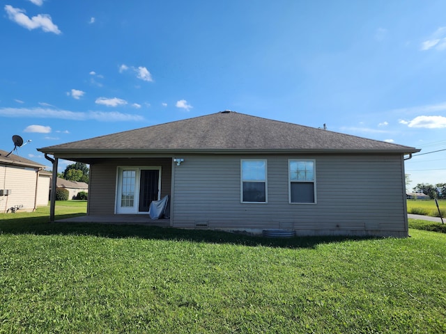 409 W Summit St, Aurora, MO 65605 - back of property with a patio area, roof with shingles, and a yard