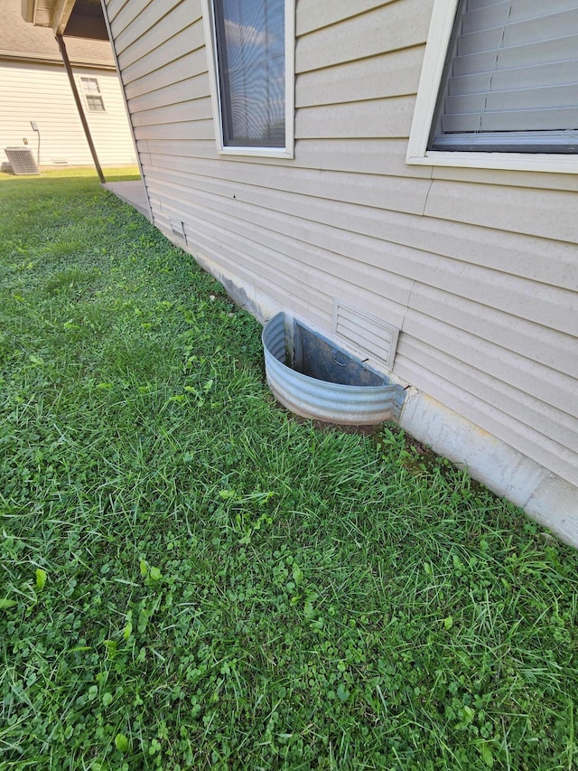 view of yard with central air condition unit