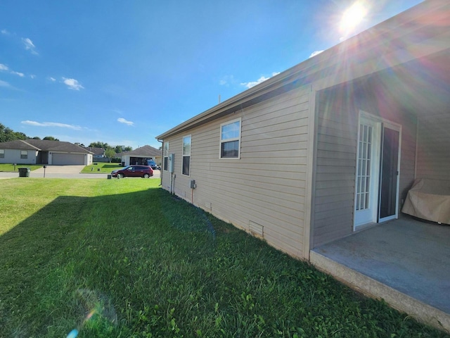 view of side of property featuring a yard