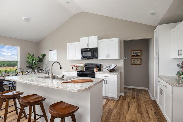 kitchen featuring white cabinets, sink, and black appliances