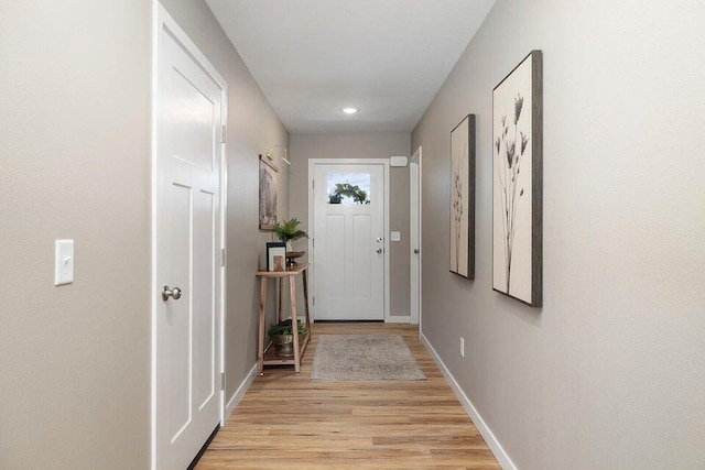 doorway to outside with light hardwood / wood-style flooring