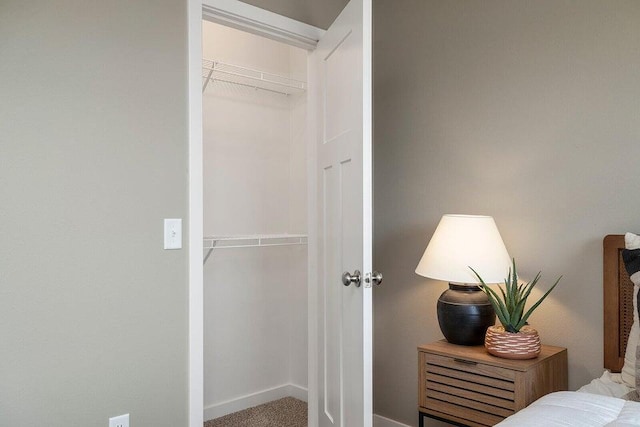 carpeted bedroom with a closet