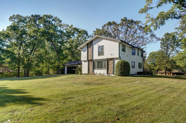 front of property featuring a garage and a front lawn