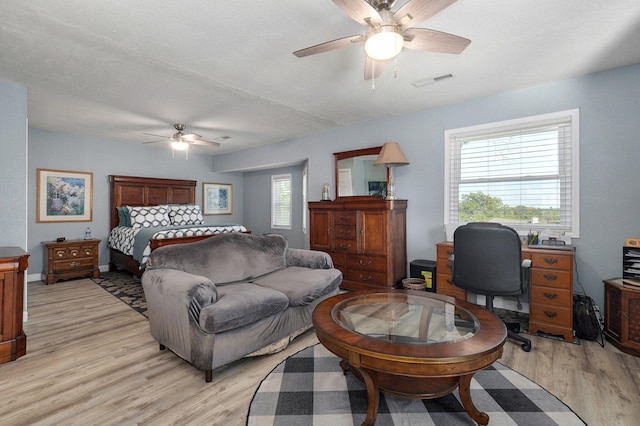 bedroom featuring light hardwood / wood-style floors and ceiling fan