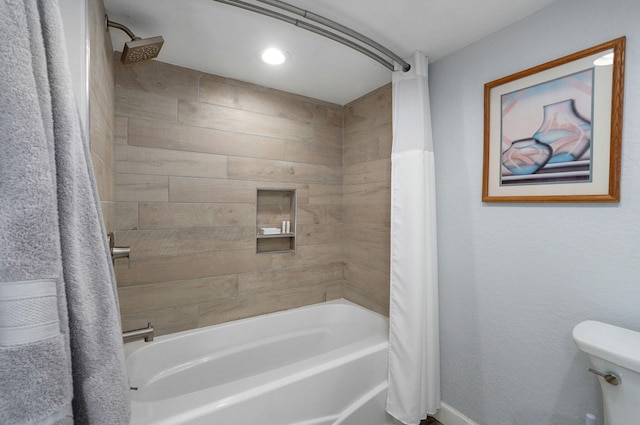 bathroom featuring shower / bathtub combination with curtain and toilet