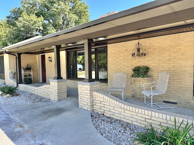 property entrance with a patio area