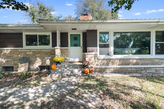 doorway to property with covered porch