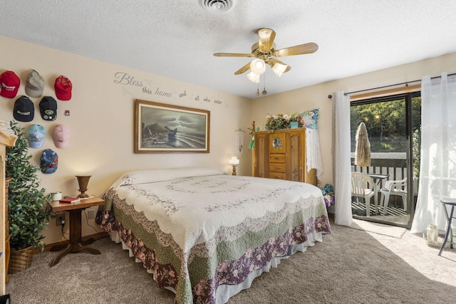 carpeted bedroom with access to exterior, a textured ceiling, and ceiling fan