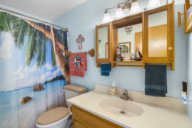 full bathroom with a shower with curtain, vanity, a textured ceiling, and toilet