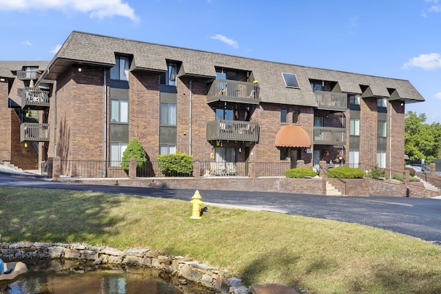 view of building exterior featuring a water view