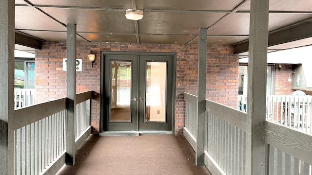 view of exterior entry featuring french doors