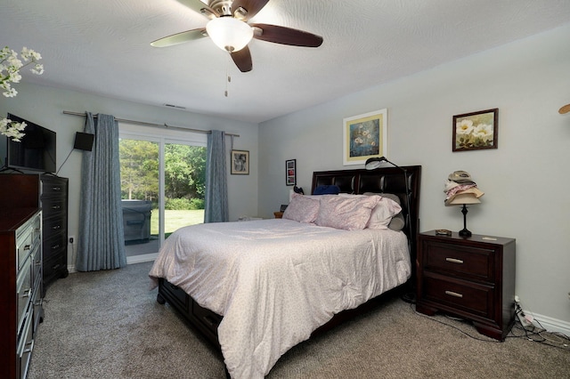 bedroom featuring light carpet, a textured ceiling, and ceiling fan