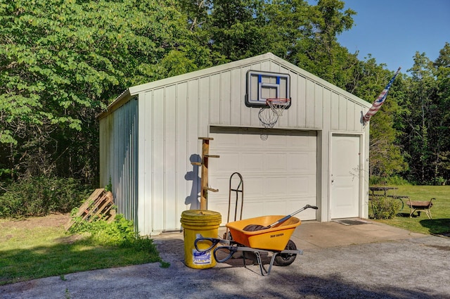 garage featuring wood walls