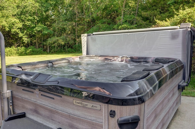 exterior details featuring carpet flooring and a hot tub