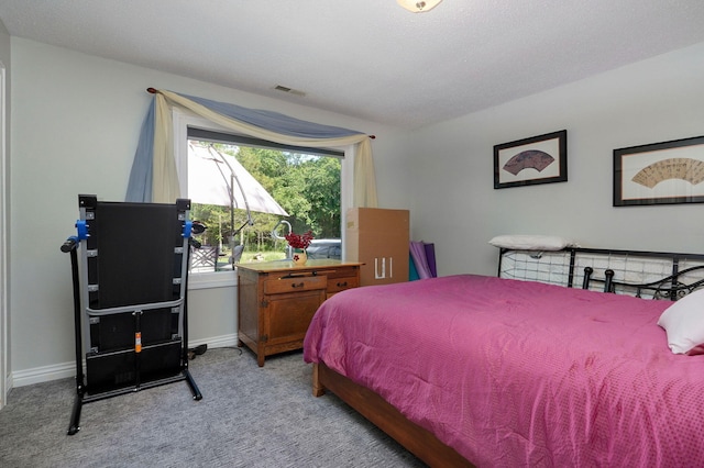 bedroom featuring light colored carpet