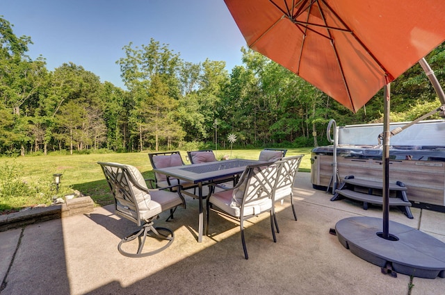 view of patio / terrace with a hot tub