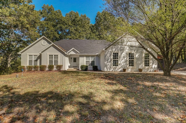 single story home featuring a front yard