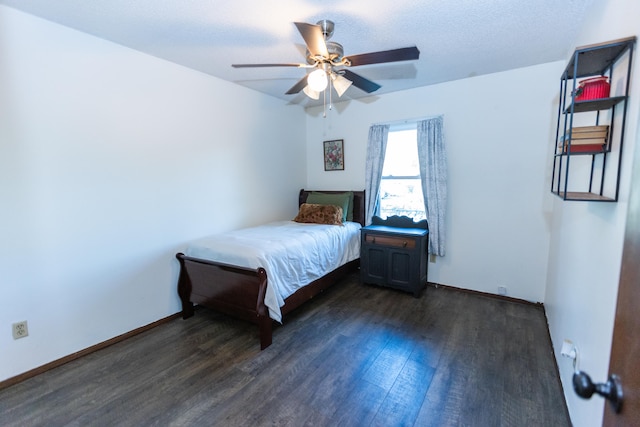 unfurnished bedroom with dark wood-type flooring and ceiling fan