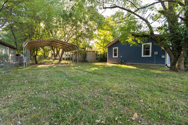 view of yard featuring cooling unit and a carport