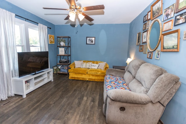 living room with dark hardwood / wood-style floors and ceiling fan