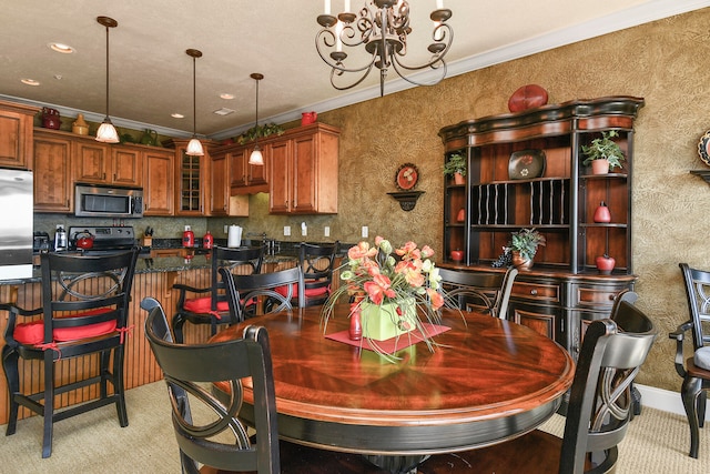 carpeted dining space featuring crown molding and a chandelier