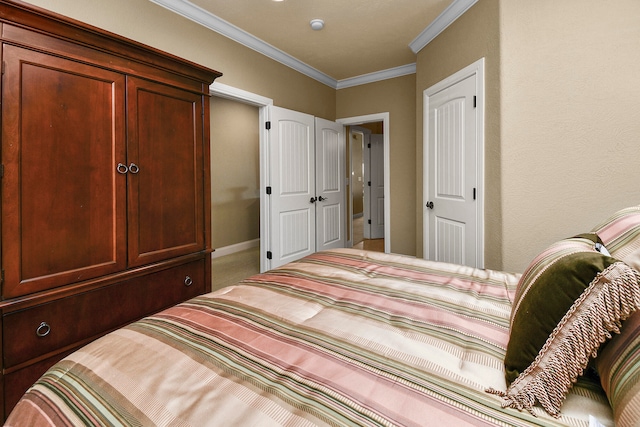 bedroom with crown molding and carpet flooring