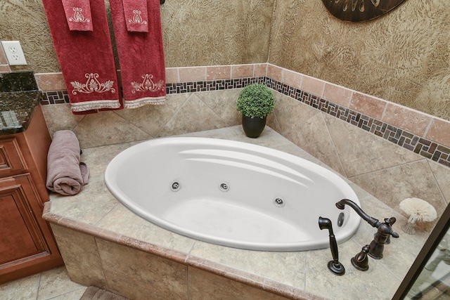 bathroom with tiled bath