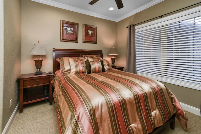 bedroom with ornamental molding, light colored carpet, and ceiling fan