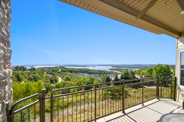 balcony featuring a water view