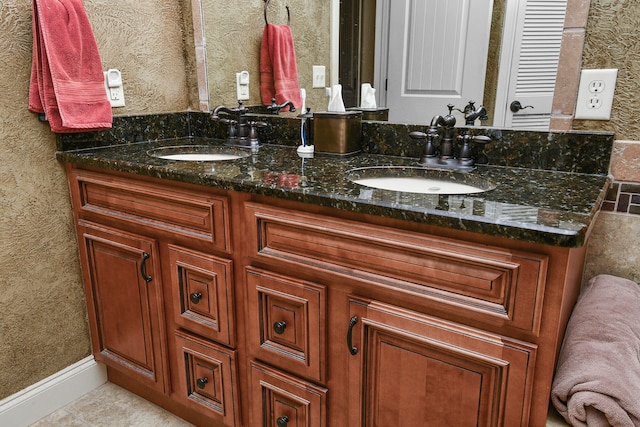 bathroom featuring tile patterned floors and vanity