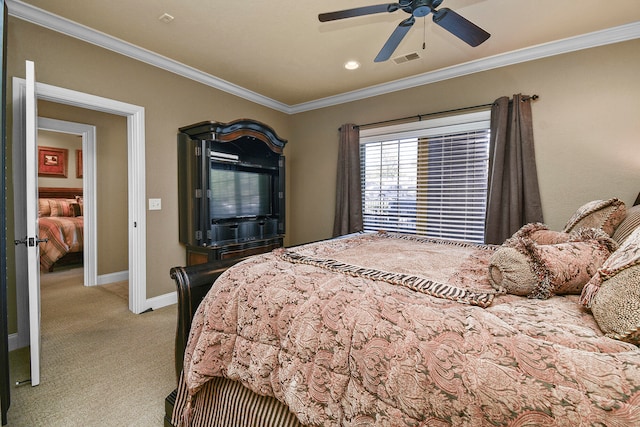 carpeted bedroom featuring ornamental molding and ceiling fan