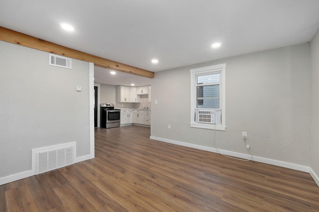 unfurnished living room featuring dark hardwood / wood-style floors and cooling unit