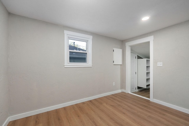 empty room with hardwood / wood-style floors