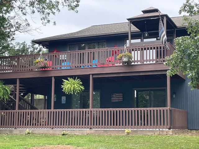 back of property with a wooden deck